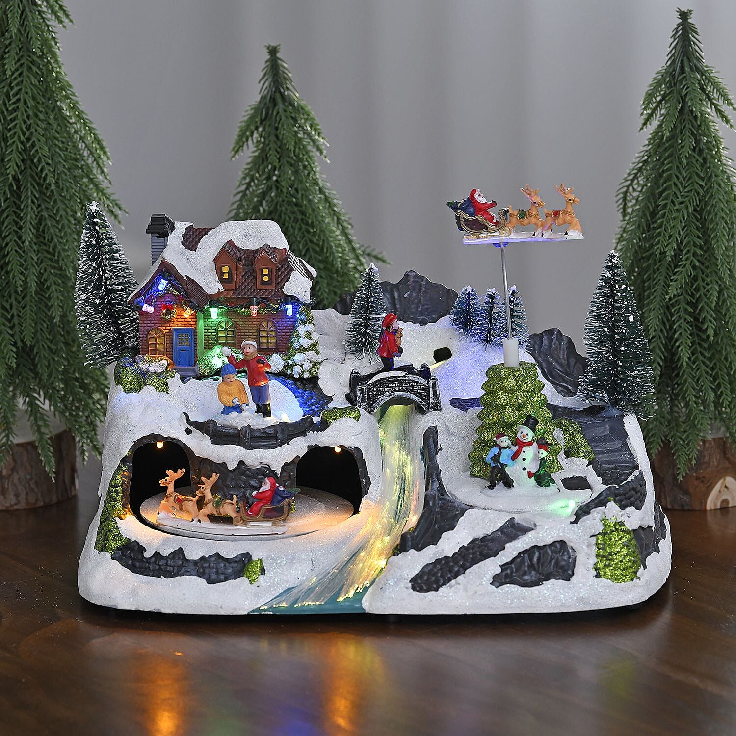Christmas LED Village with Flying Sleigh & Music (Size 30x20x20 Cm) 3 x AA batteries not included