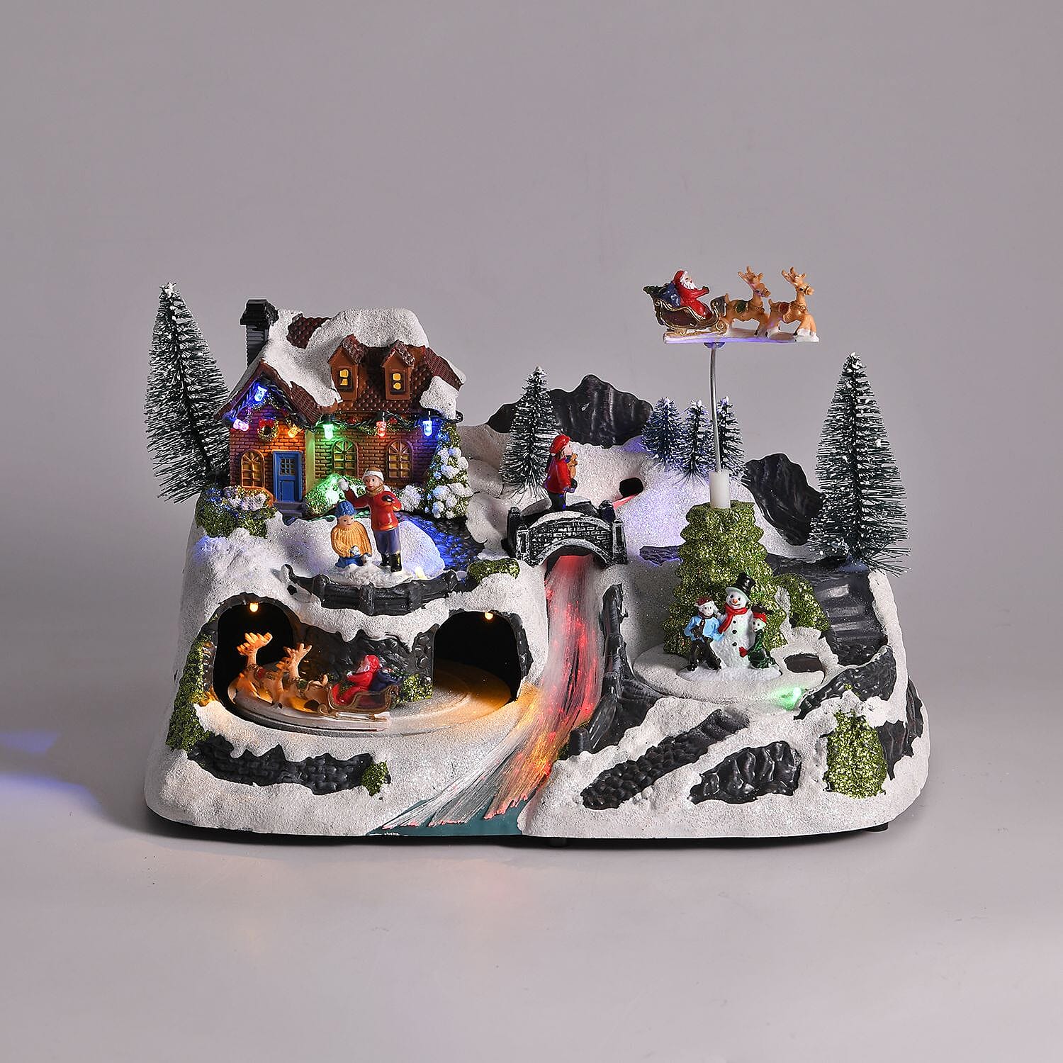 Christmas LED Village with Flying Sleigh & Music (Size 30x20x20 Cm) 3 x AA batteries not included
