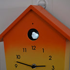 Modern Cuckoo Wall Clock with Pendulum Powered by 3 x AA Batteries (Not Incl.) - Singing Bird with Automatic Night-Time Silent Mode - Orange