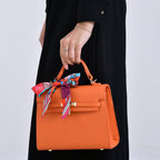 Kelly-Style Shoulder Bag with Scarf Accent & Adjustable Strap - Orange