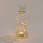 Embossed Square Glass Bottle with 18 Mini LED String Lights (Size 9x9x23 Cm)