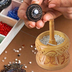 Haldoo Wood Carved Bead Spinner With Stainless Steel Needle. Spinner- 14 x 10.2 cm. Needle- 14 x 2.54 cm. WEIGHT- Approx. 0.55 lbs.