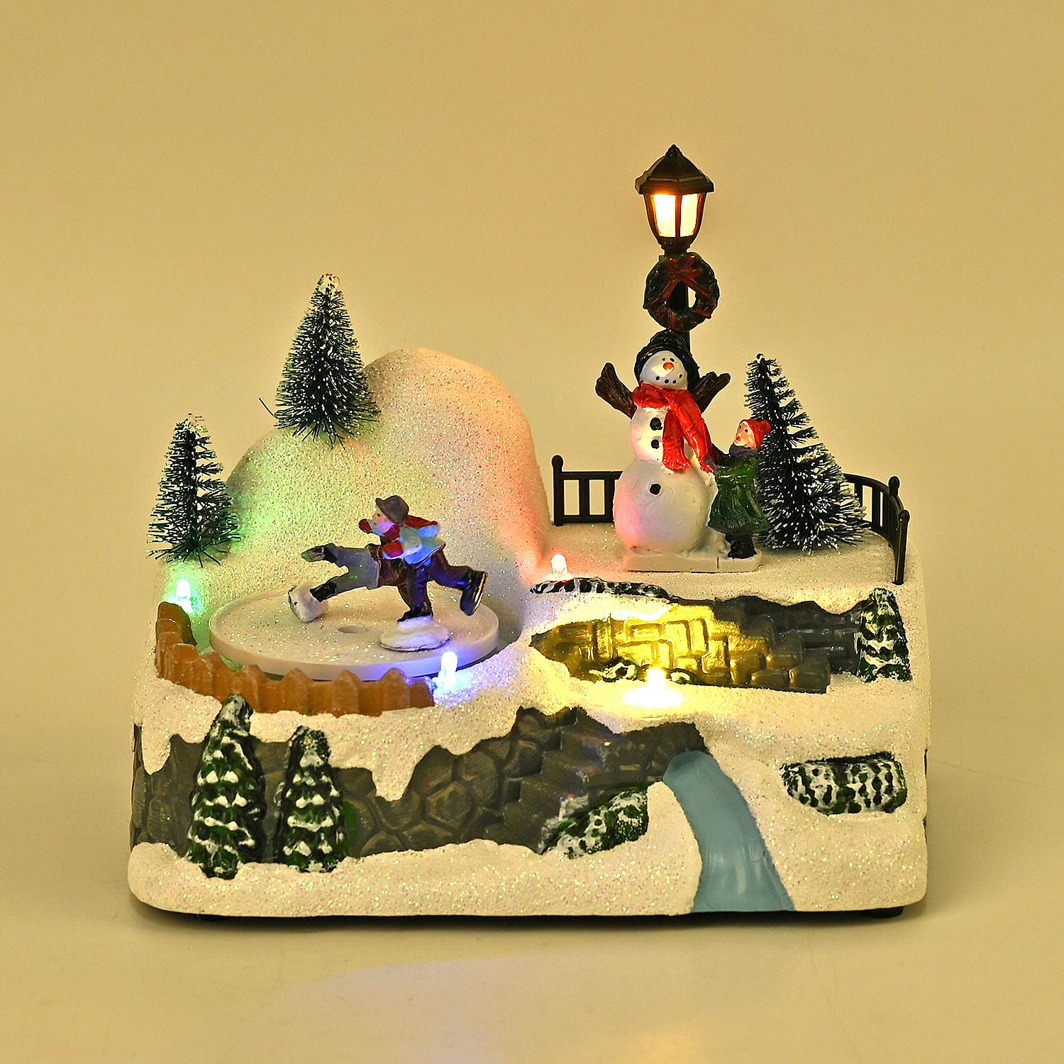 Musical Light up Christmas Village Scene with Rotating Skaters and Snowman
